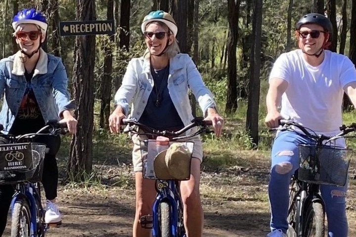 a couple of people riding on the back of a motorcycle