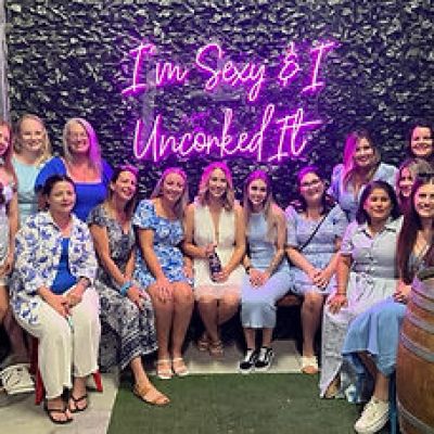 a group of people standing in front of a crowd posing for the camera