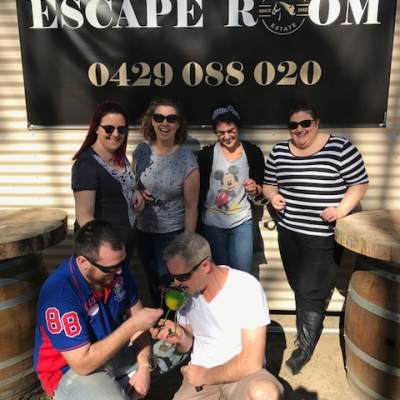 a group of people standing in front of a sign