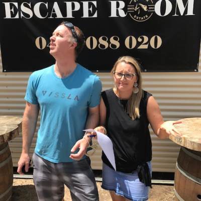 a person standing in front of a group of people posing for the camera