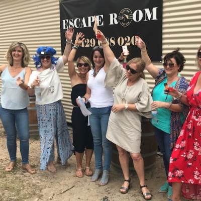 a group of people standing in front of a crowd posing for the camera