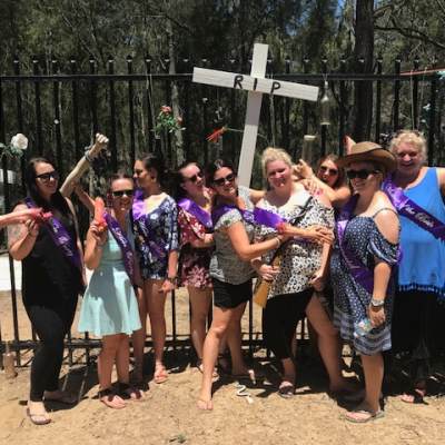 a group of people standing in front of a crowd posing for the camera