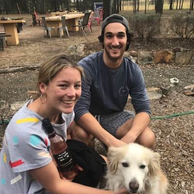 a person and a dog posing for the camera