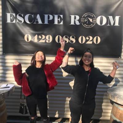 a group of people standing in front of a sign