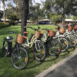 a bicycle parked on the side of a road
