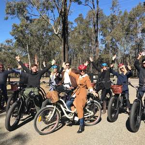 a group of people riding on the back of a motorcycle