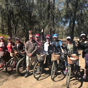 a group of people riding on the back of a motorcycle